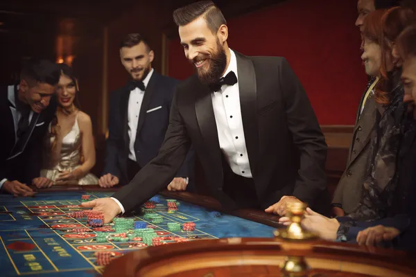A close-up shot of golden coins falling around a spinning roulette wheel, representing immersive casino action at LINEBED.